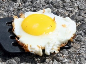 flippin hot.  eggs over sidewalk?